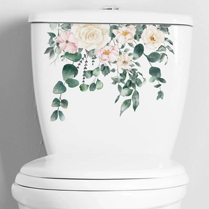 Tropical watercolor floral wall decal with pink roses and green eucalyptus on white toilet tank