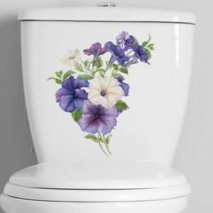 Tropical flowers and butterfly self-adhesive wall stickers on a white toilet tank
