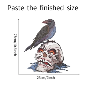 Detail showing red-eyed crow on skull sticker with exact 27cm by 23cm dimensions