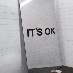 Minimalist full-length mirror with It's OK black text wall decor for bedroom or entryway
