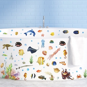 Vibrant watercolor sea animal wall decals featuring dolphins and turtles on a white bathtub