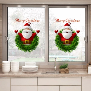 Merry Christmas window stickers featuring Santa Claus and green wreaths for home decor