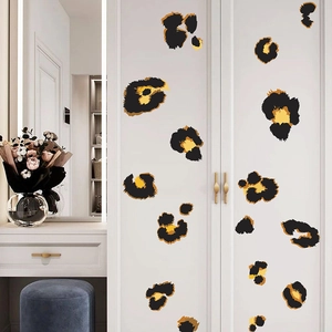 Modern leopard print wall stickers for home decor shown on a white minimalist wardrobe