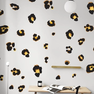 Modern leopard print wall decals for bedroom decor featuring yellow and brown animal spots