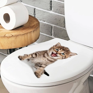 Realistic 3D tabby kitten wall sticker applied to a white toilet lid for bathroom decor