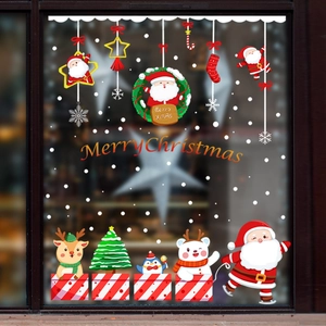 Cartoon Christmas window stickers featuring Santa, reindeer, and snowflakes for glass decoration