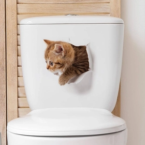 3D illusion wall sticker showing a cute ginger kitten peeking through a torn hole for home decor