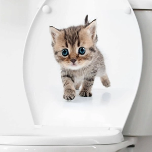 3D kitten wall sticker with blue eyes walking on a white toilet lid for bathroom decor