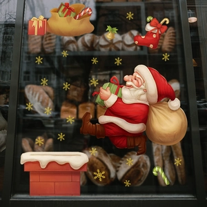 Autocollants de fenêtre Père Noël festifs sur vitrine de boulangerie avec sac de cadeaux