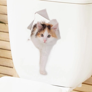 Detailed view of a 3D cat wall sticker with realistic crack effect on a white toilet tank