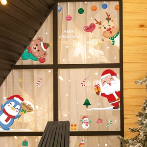 Festive Christmas window stickers with Santa, reindeer, and penguins for glass decoration