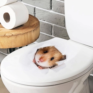 Detail of 3D hamster wall sticker showing a realistic peering effect on a white surface