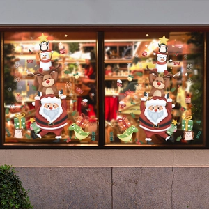 Christmas window stickers featuring cartoon Santa and animals in stacking tower design
