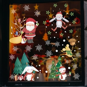 Christmas window stickers featuring Santa, snowman, and snowflakes for holiday glass decor