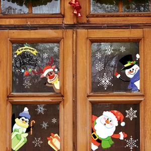 Adesivi natalizi per finestre con Babbo Natale e renne su porta in vetro