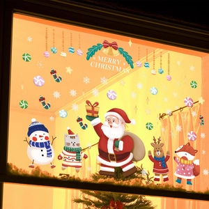 Detailed view of Merry Christmas window stickers with cartoon Santa, reindeer, and snowflakes