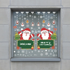 Christmas window stickers with Santa, snowflakes, and Merry Christmas signs on glass