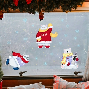 Detailed close-up of three cute Christmas polar bear window stickers with snowflake decor