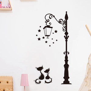 Detail of black vinyl wall sticker featuring vintage street lamp, stars, and cat silhouettes