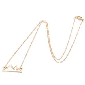 Detailed view of gold-plated mountain peak pendant with lobster clasp and cable chain