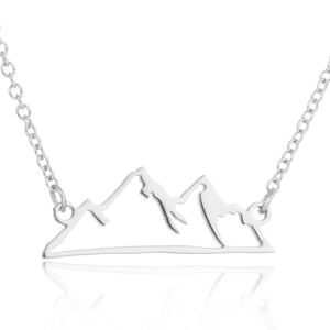 Detailed view of mountain peak pendant with hollowed silver design and link chain
