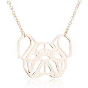 Macro detail of gold pug pendant with geometric cutout design and high-polish finish