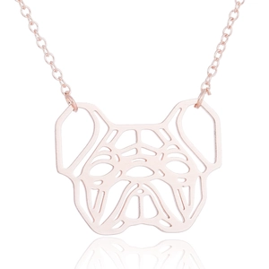 Detail of rose gold geometric hollow pug pendant necklace with elegant thin chain links