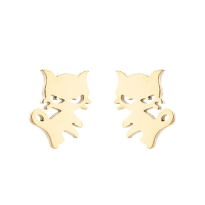 Macro detail of golden cat studs showing delicate hollow face features and glossy finish
