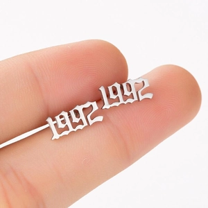 Macro view of silver 1992 year stud earring with gothic number design for women