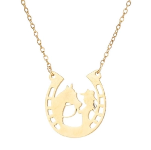 Macro shot of 18K gold horseshoe pendant with hollow horse and girl silhouette