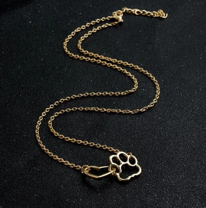 Elegant gold hollow dog paw print heart pendant necklace with adjustable chain