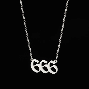 Detailed close-up of gothic silver 666 pendant on stainless steel chain for unisex style