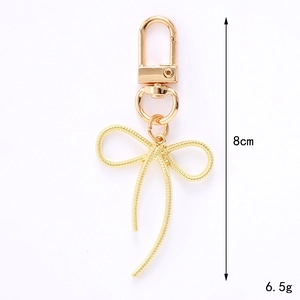 Porte-clés doré en forme de nœud avec fermoir en D, hauteur 8cm, poids 6.5g, en métal