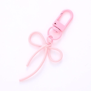 Pendentif nœud rose avec fermoir mousqueton pour coque de téléphone et sac à dos