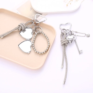 Elegante portachiavi a specchio a cuore argento con strass e ciondolo a nodo