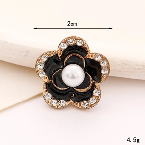 Detailed 2cm camellia charm with black enamel, faux pearl center and sparkling rhinestones