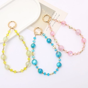 Chic beaded phone charm strap with iridescent crystals and golden butterfly accents