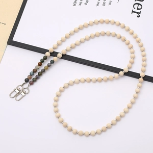 Detail of natural wood bead lanyard with colorful stone accents and metal lobster clasps