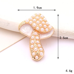 Detail view of pearl mushroom charm with 1.9cm x 2.5cm dimensions and 4.6g weight
