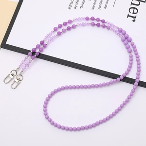 Detail view of purple stone beaded crossbody chain with silver lobster claw metal clasps