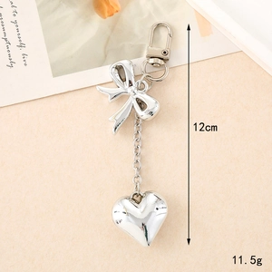 Silver bow and heart metal keychain for bags and phones, length 12cm, weight 11.5g