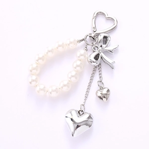 Creative pearl heart phone charm with silver bowknot and twin heart pendants