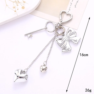Y2K silver metal heart keychain with bow and key charms for bags and phones, 16cm length
