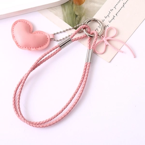 Pink heart leather keychain with woven rope and bow pendant for bags and phones