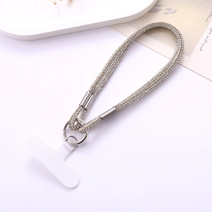 Close-up of sparkling silver rhinestone wrist strap with metallic ring and white T-patch