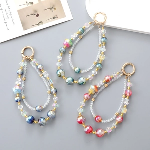Double-layered iridescent beaded phone charms with gold spring clasps in three colors