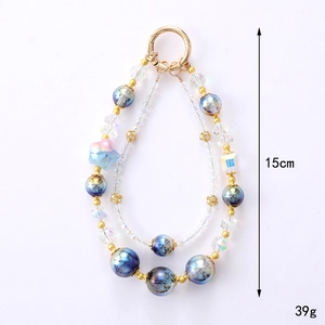 Dreamy mermaid beaded phone charm featuring star-shaped beads and gold ring clasp