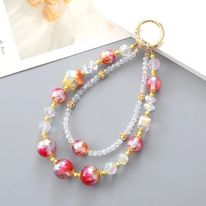 Beaded keychain with pink marble glass beads and gold star charms for bags