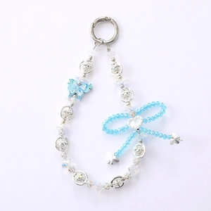 Elegant beaded butterfly keychain with blue gradient pendant and heart bow on white background