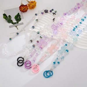 Detailed view of colorful beaded chains with butterfly and star motifs for phone or bags